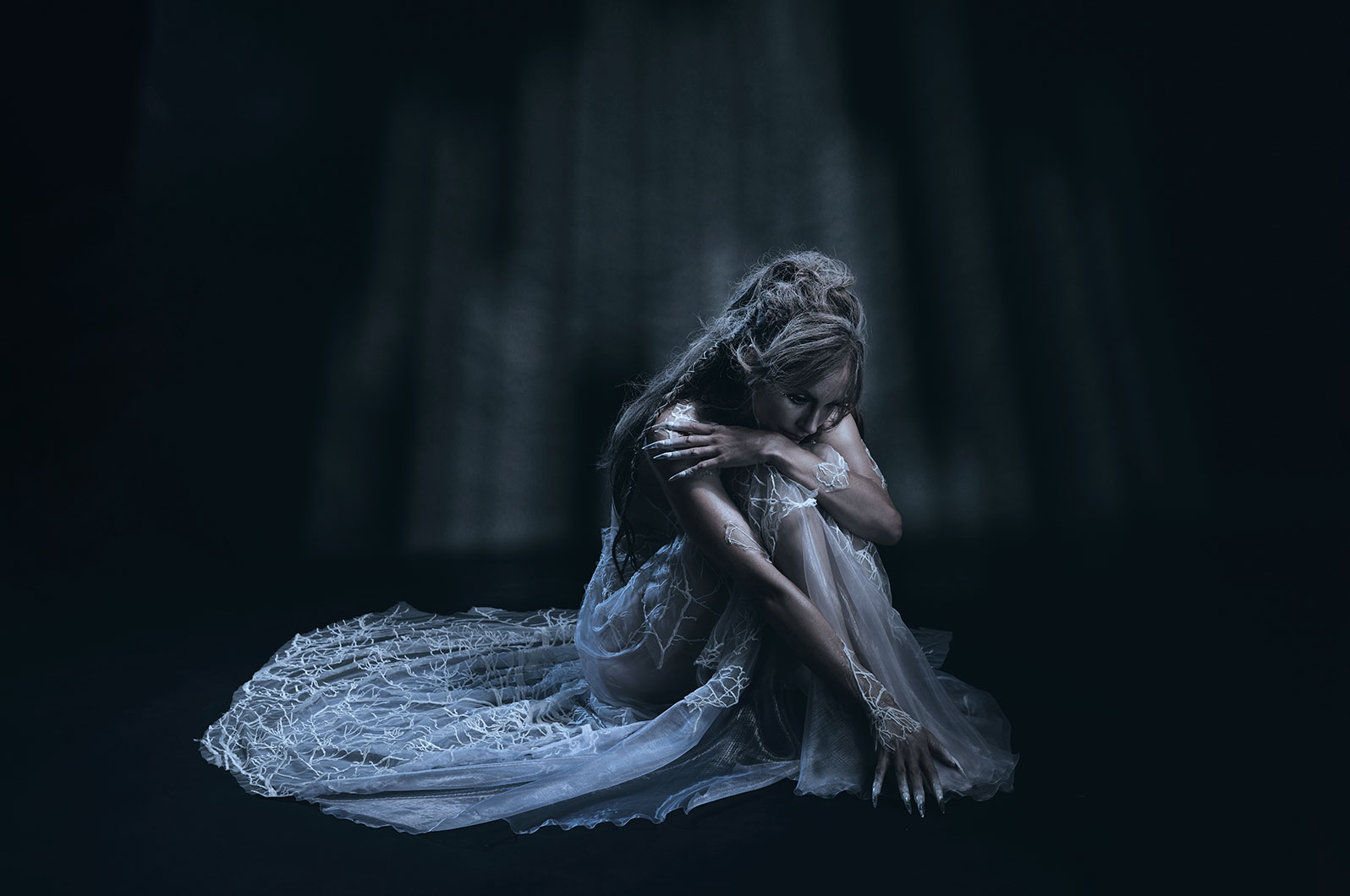 Detail image of the mattress lit to show the fabric texture.