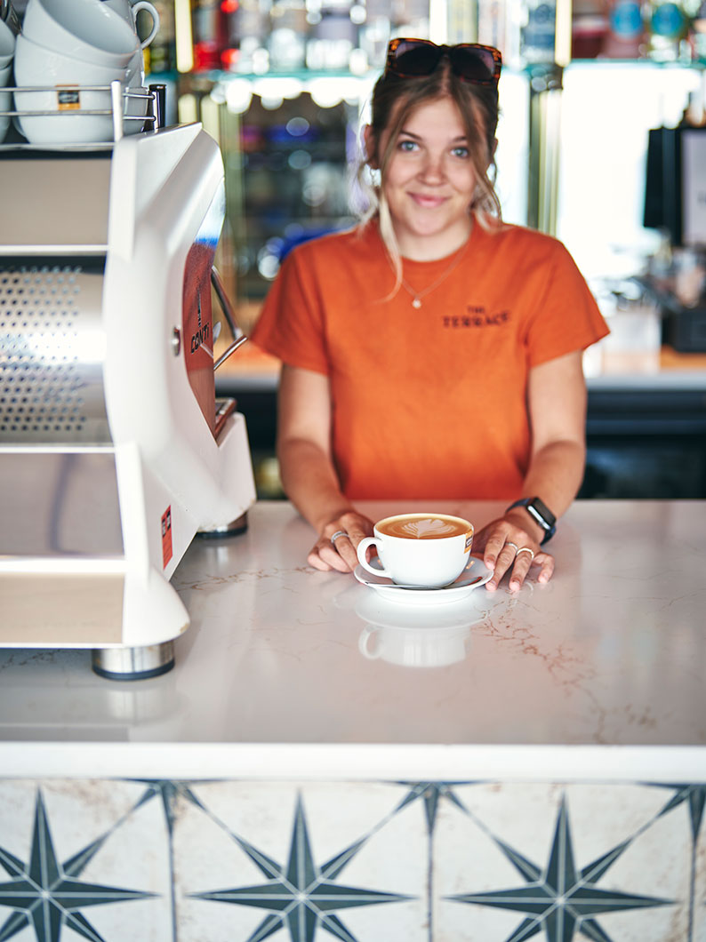 Studio shot using a model in complementary colours lit to convey the warming nature of soup.